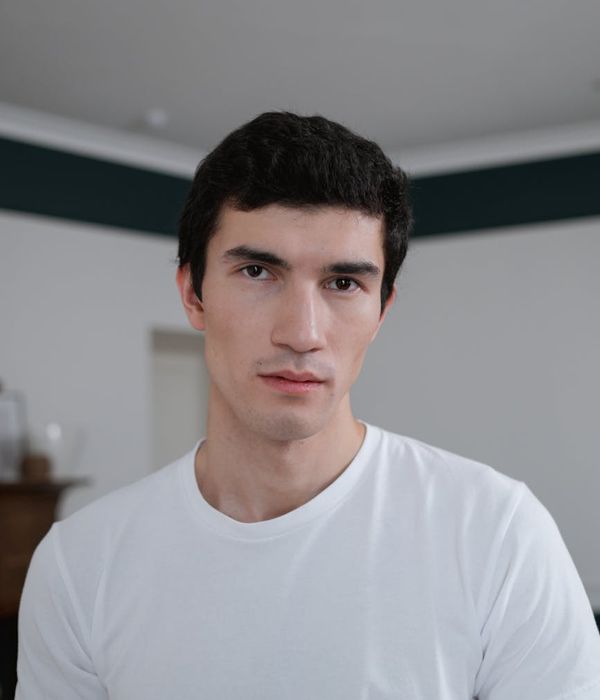 Woman with a calm and focused expression looking forward.